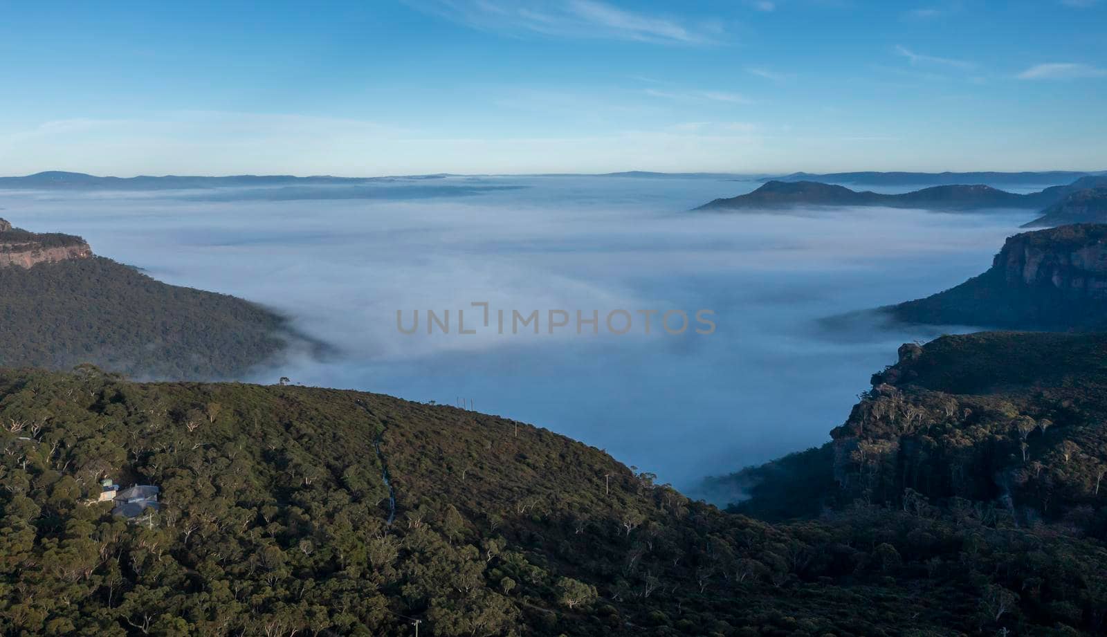 Aerial view of fog in Megalong Valley in The Blue Mountains in Australia by WittkePhotos