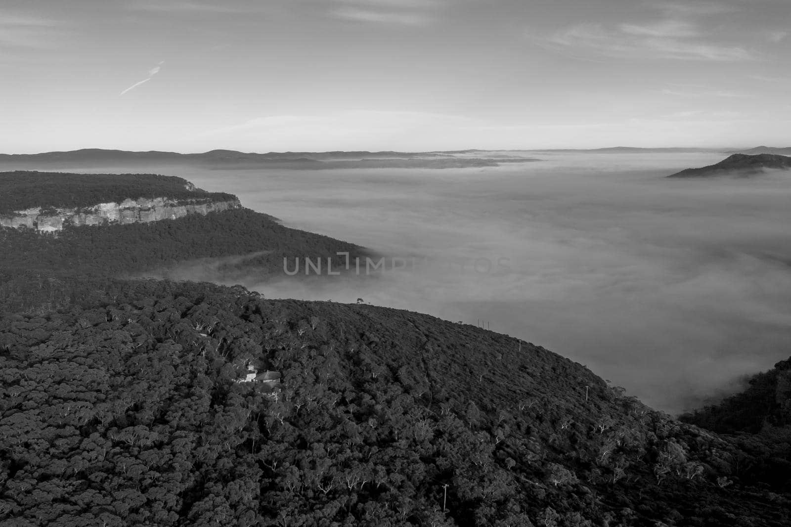 Aerial view of fog in Megalong Valley in The Blue Mountains in Australia by WittkePhotos