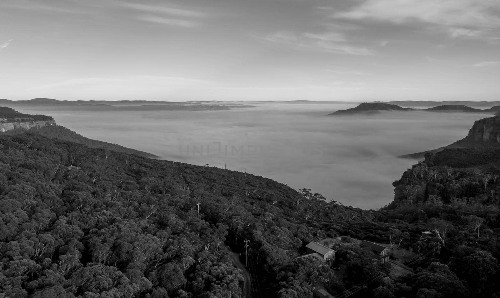Aerial view of fog in Megalong Valley near Blackheath in The Blue Mountains in regional New South Wales in Australia