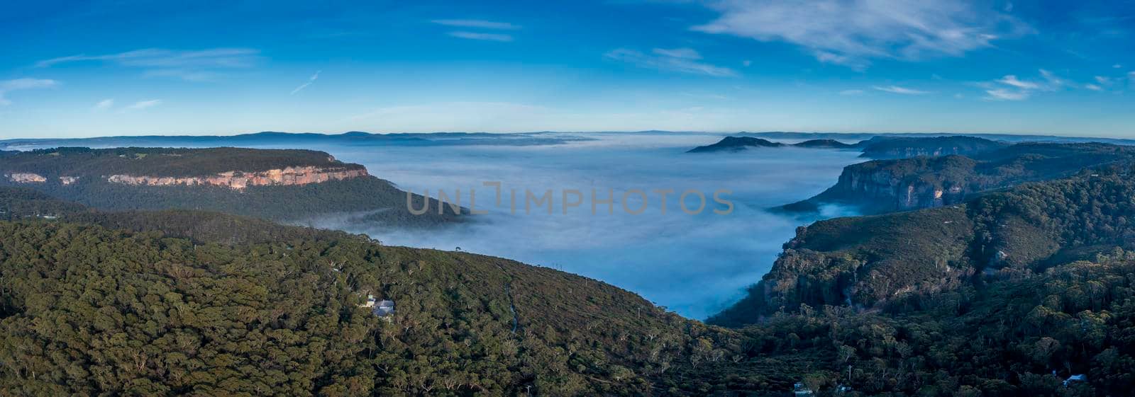 Aerial view of fog in Megalong Valley in The Blue Mountains in Australia by WittkePhotos