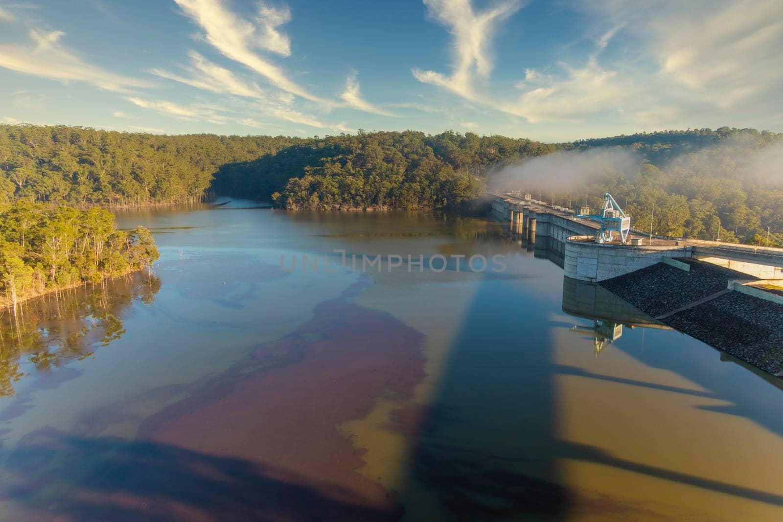 The Dam wall of a large fresh water reservoir in regional Australia by WittkePhotos