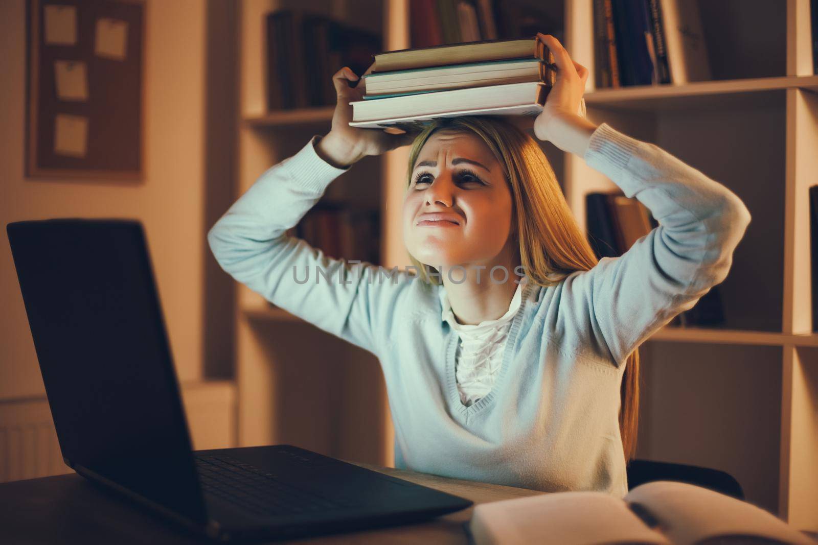 Student is frustrated because she has too much to learn at home.