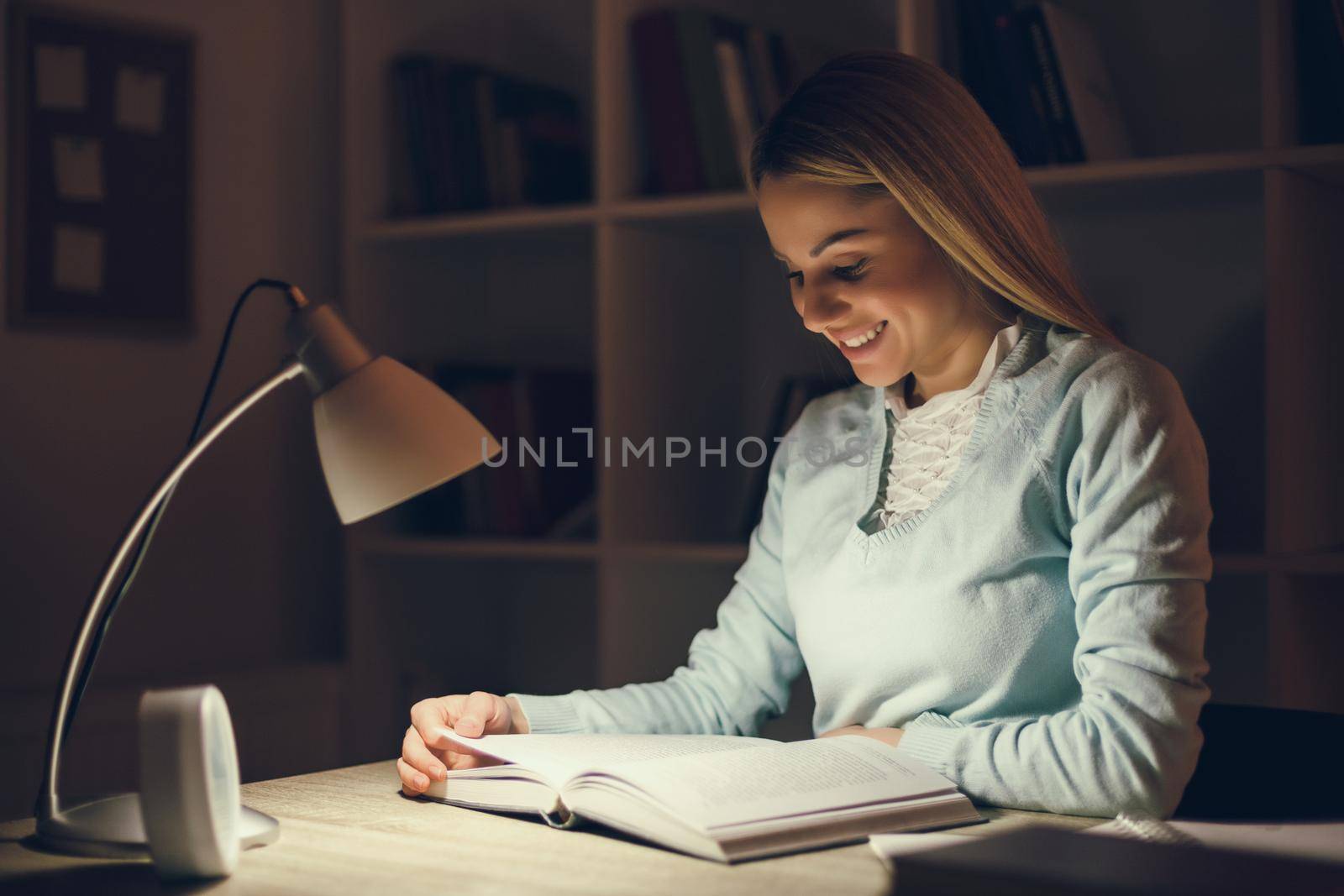 Student learning at home at night.