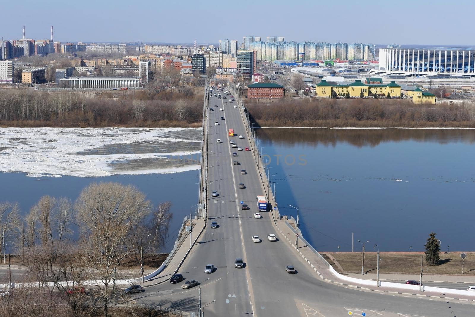 Panorama of the port city with modern buildings, a large bridge over the river. High quality photo