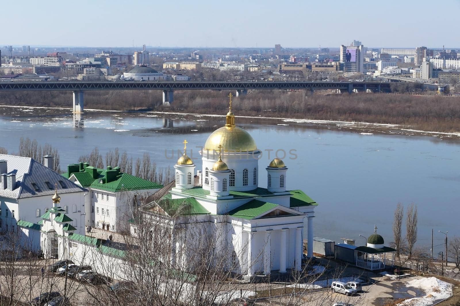 Panoramic views of the port city with churches, a river and a bridge over the river. by Olga26