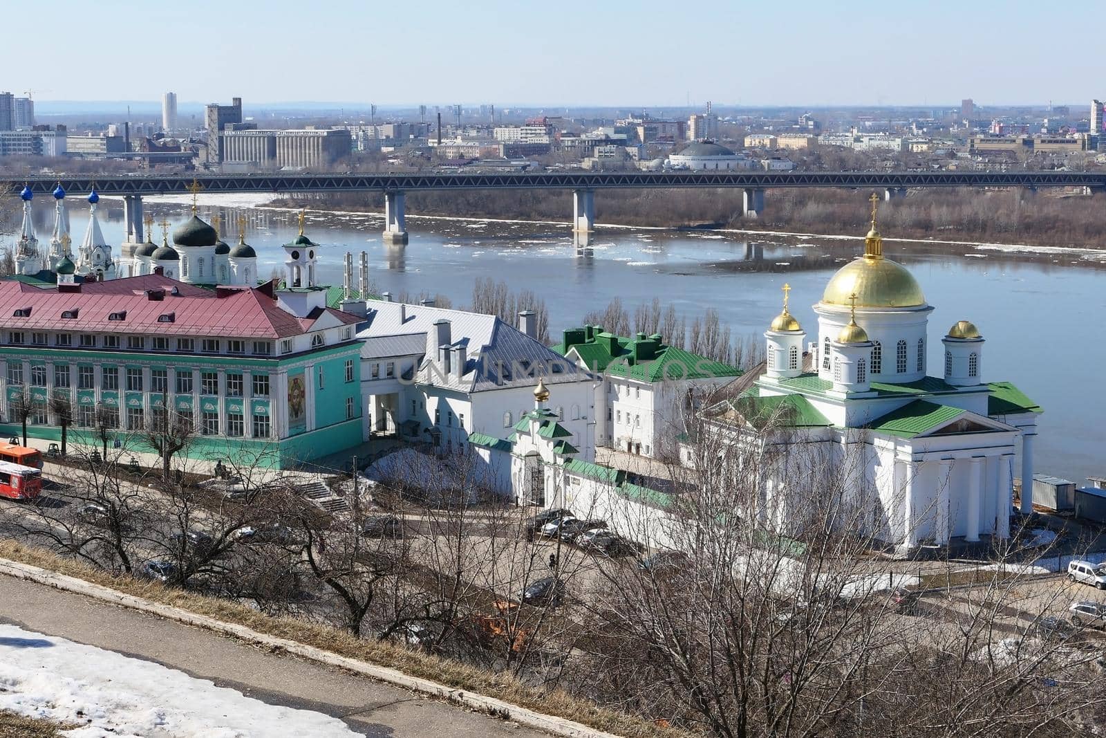 Panoramic views of the port city with churches, a river and a bridge over the river. by Olga26