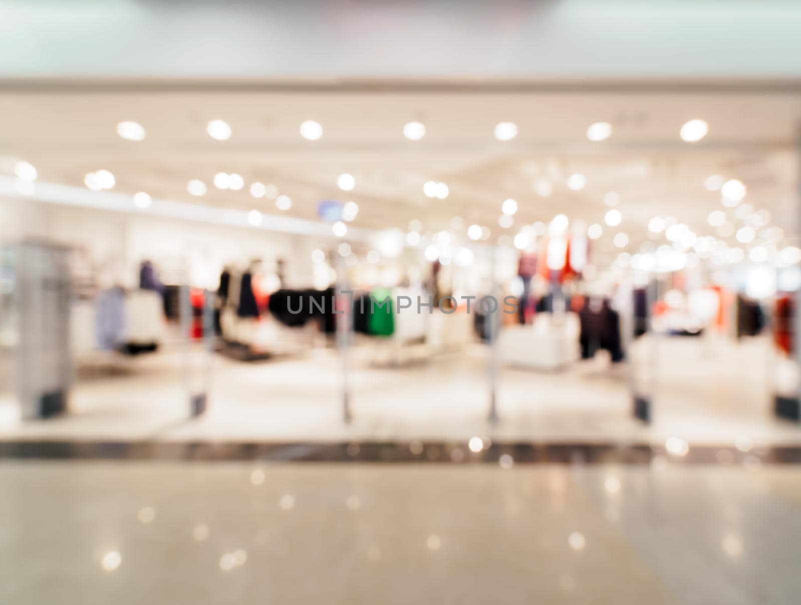 Shopping mall blur background with bokeh. Blurred hall of shopping mall as background.