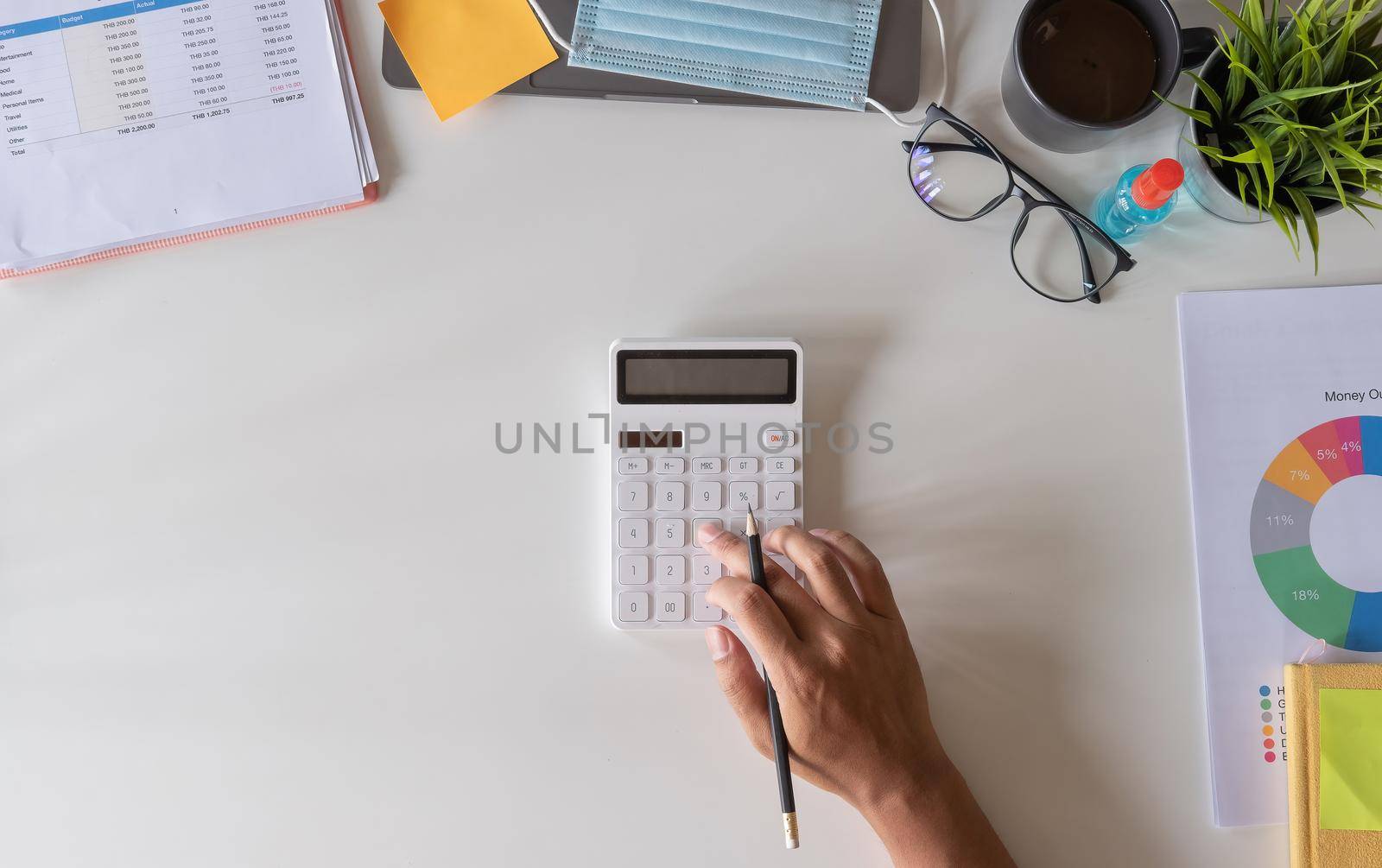 business, accounting and freelance concept - Man working calculator, papers for financial tax at office