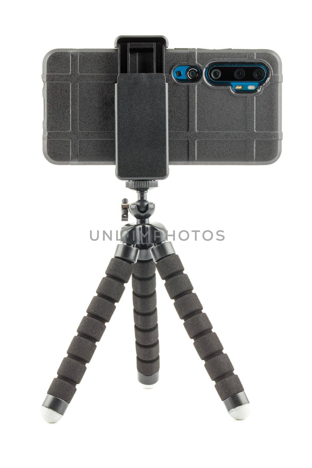 black cellphone in rugged rubber protective cover on small flexible tripod isolated on white background