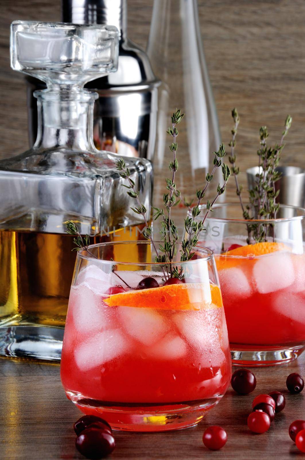 Cocktail Cranberry Orange Bourbon Smash with a spicy hint of thyme