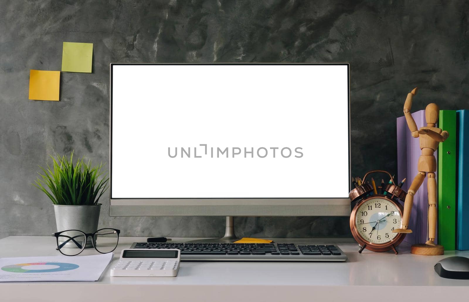 Blank screen Laptop computer and poster workspace background in modern office.