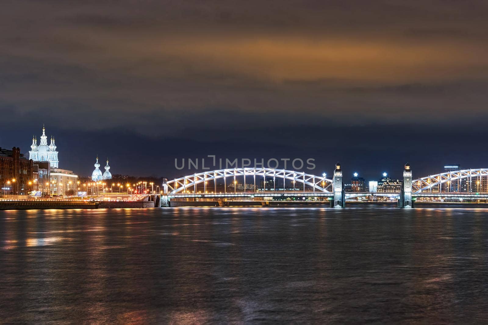 Smolny Cathedral and Peter the Great Bridge over the Neva River. Russia, Saint Petersburg, night city landscape