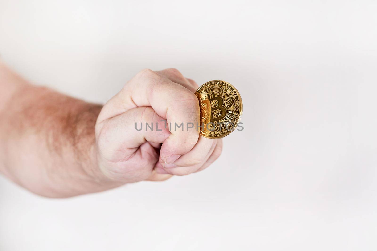 Hand holds a coin depicting a bitcoin symbol depicting a fig by vizland