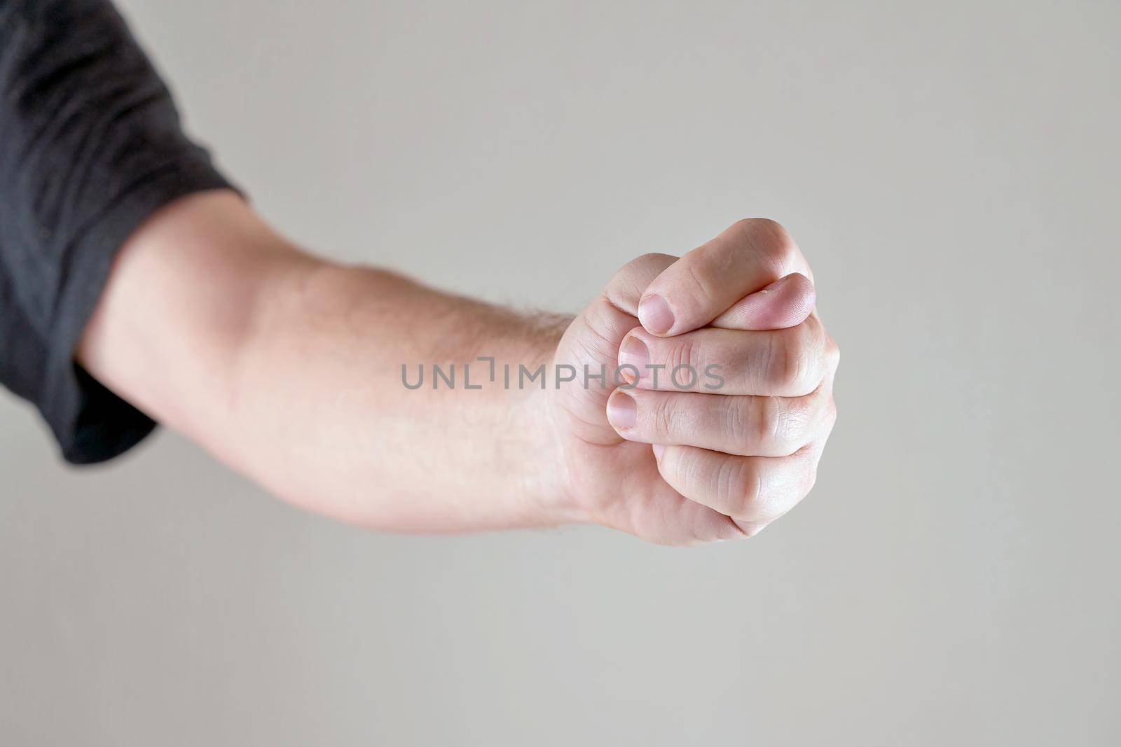 A man hand clenched into a fist shows a fig by vizland