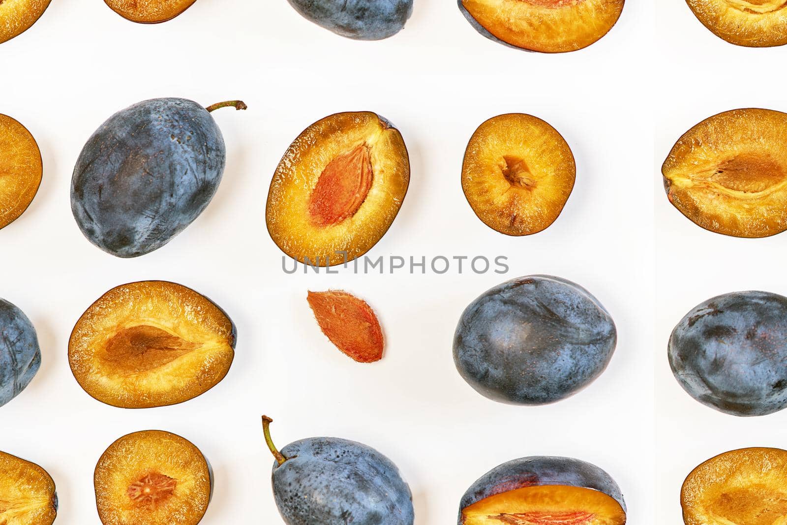 Pattern of plum berries laid out in lines on a white background in various forms by vizland