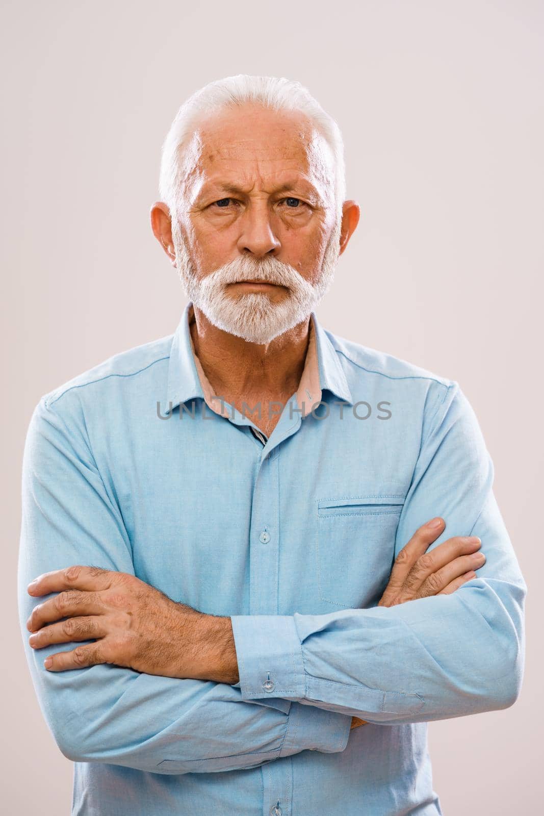 Portrait of pensive and serious senior man.