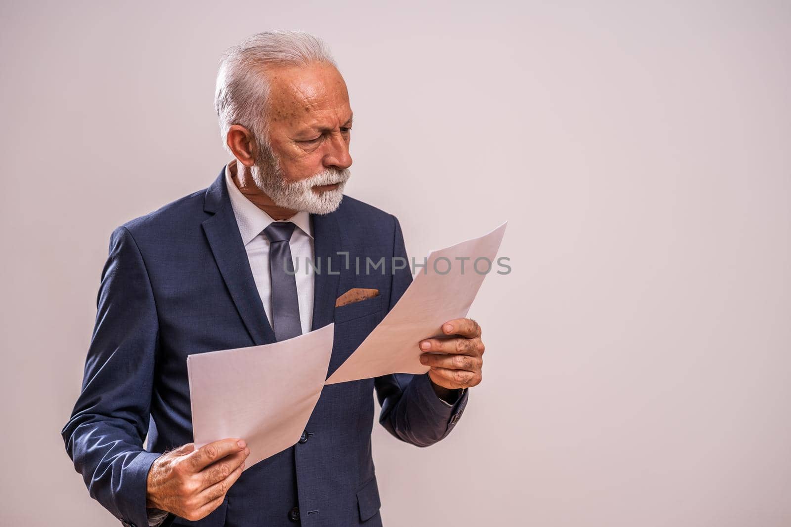 Portrait of serious and pensive senior businessman.