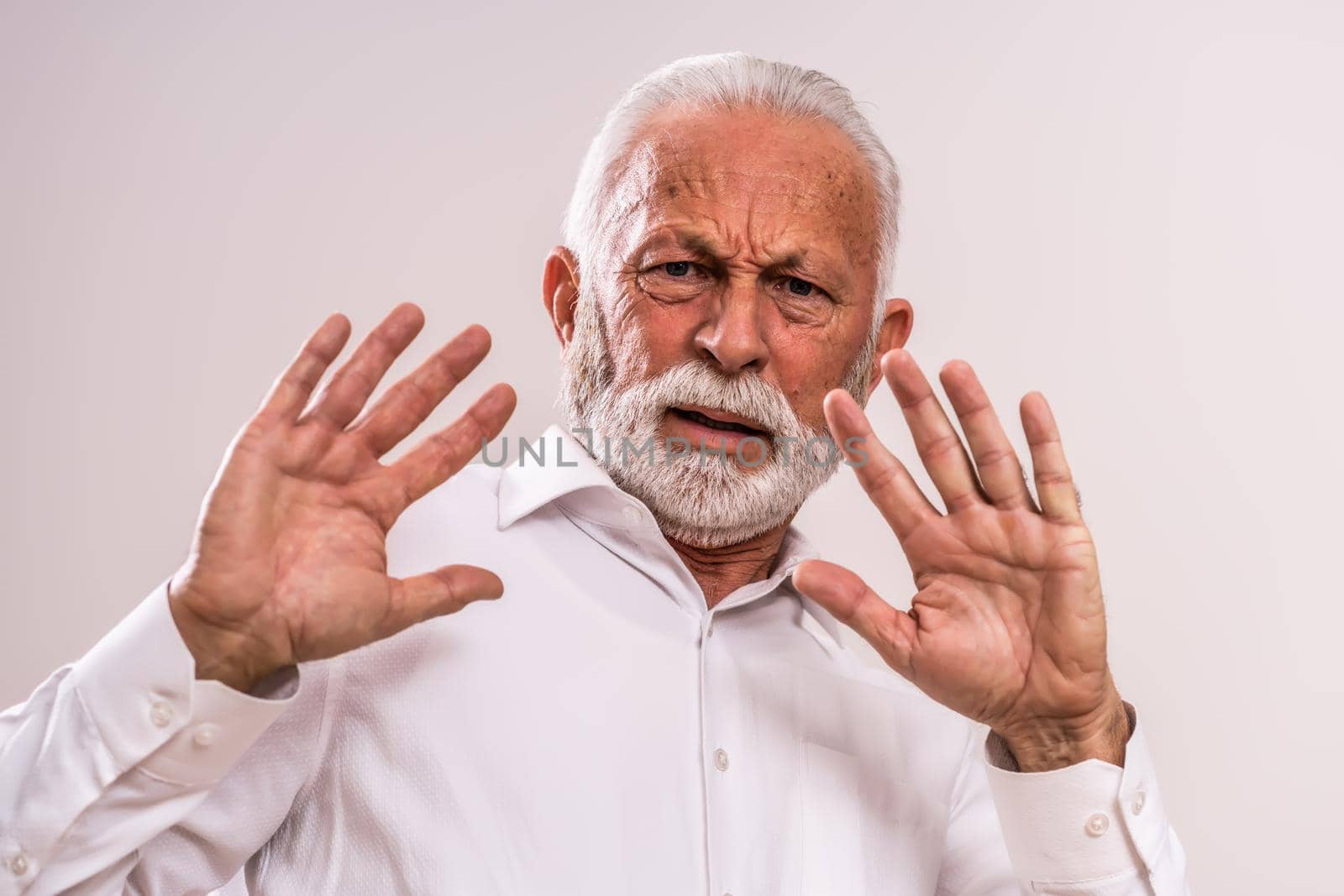 Portrait of senior man who is scared of something.