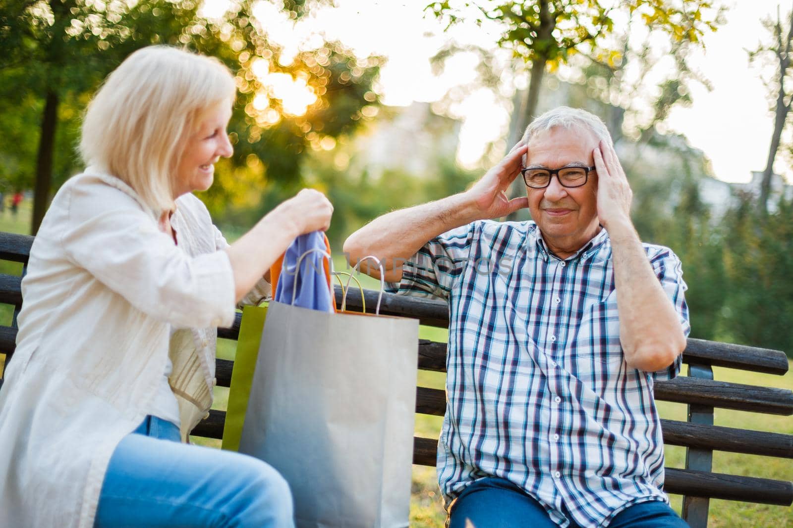 Senior man is angry because his woman is spending money on clothes.