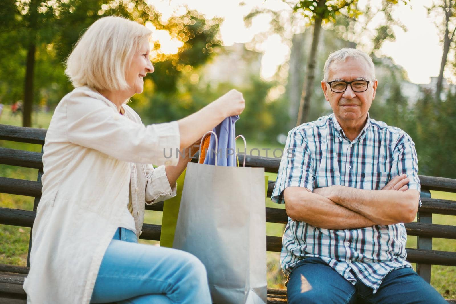 Senior man is angry because his woman is spending money on clothes.