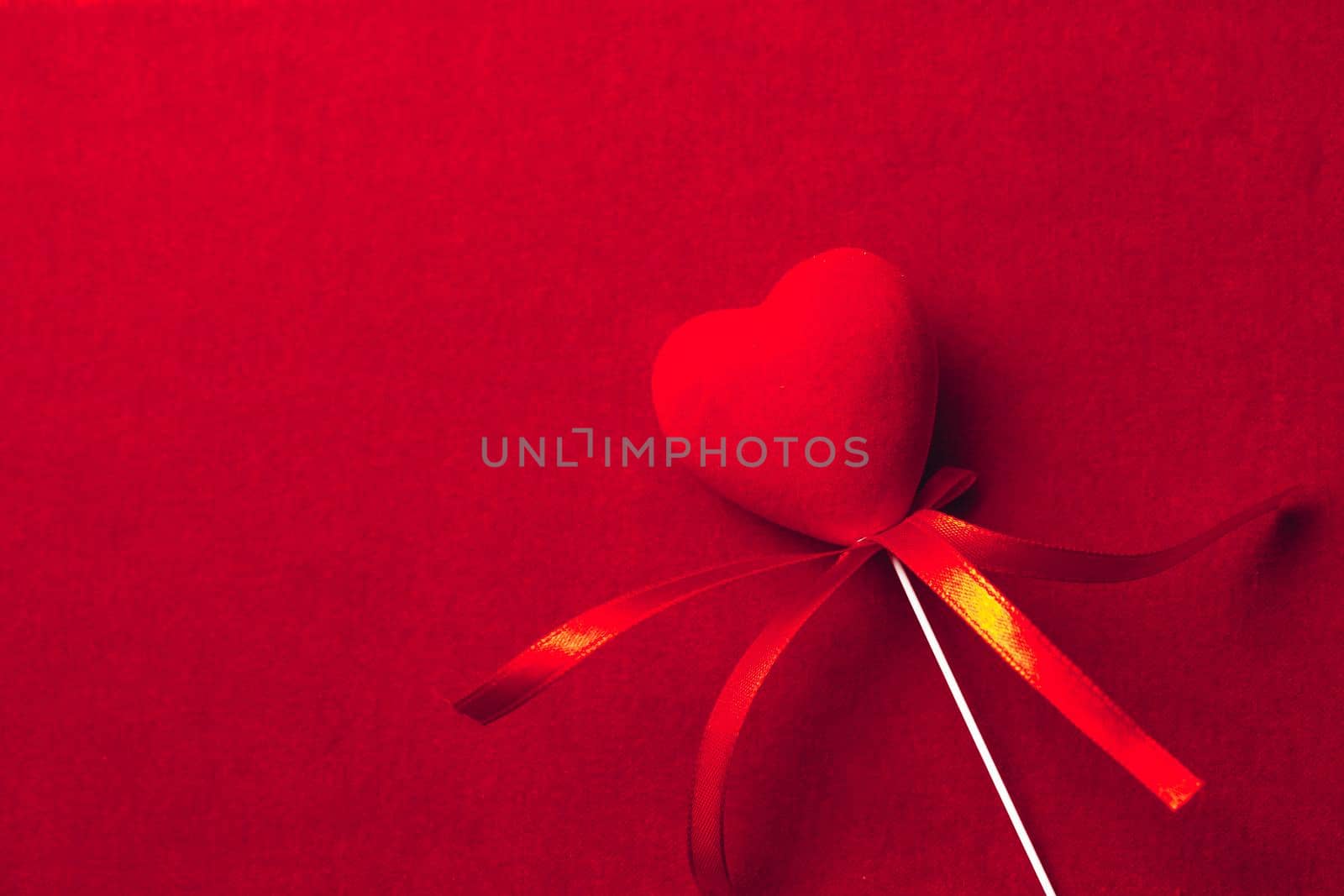 red heart shape decoration on textile background