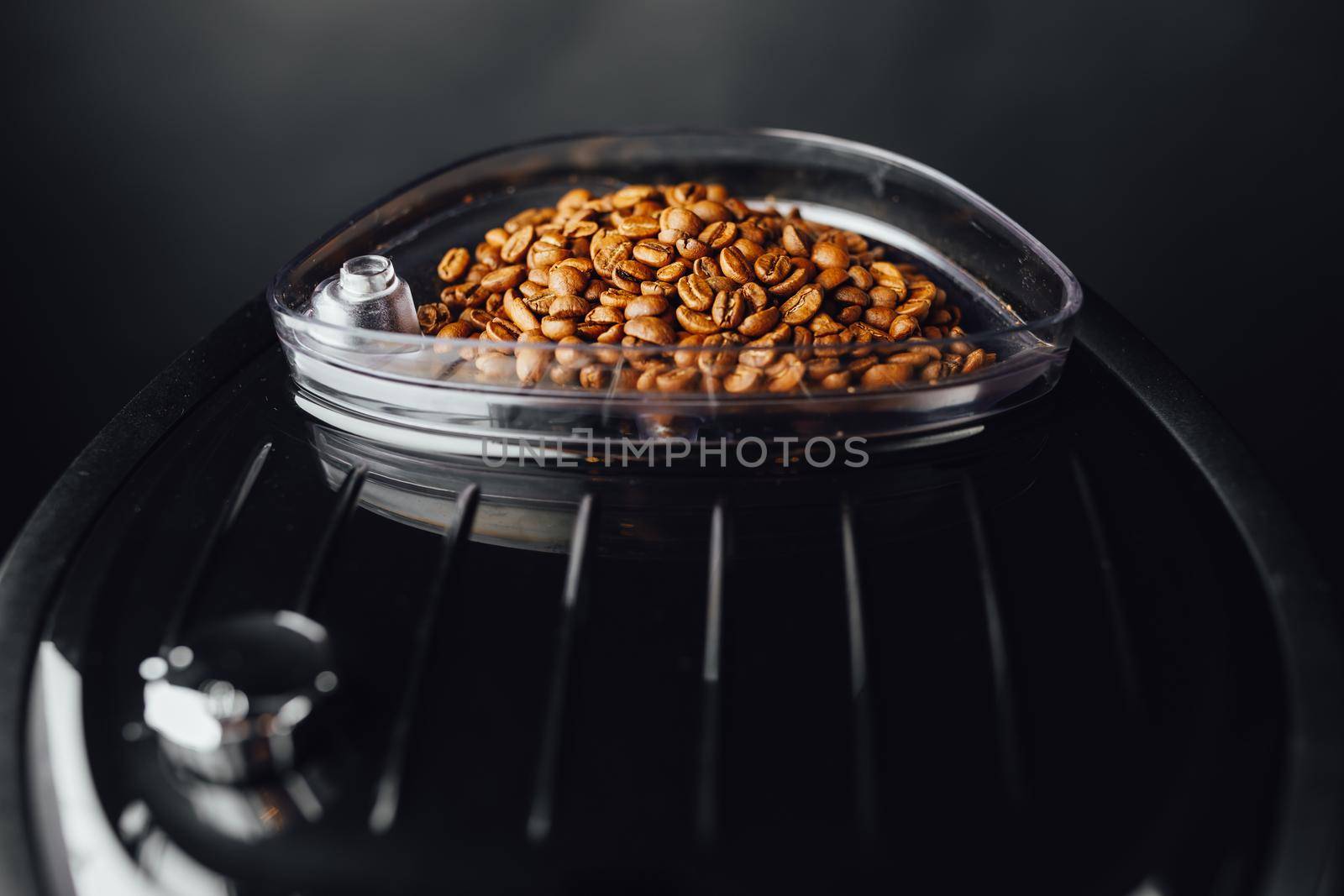 coffee beans in coffeemaker bean container, close-up view by nikkytok