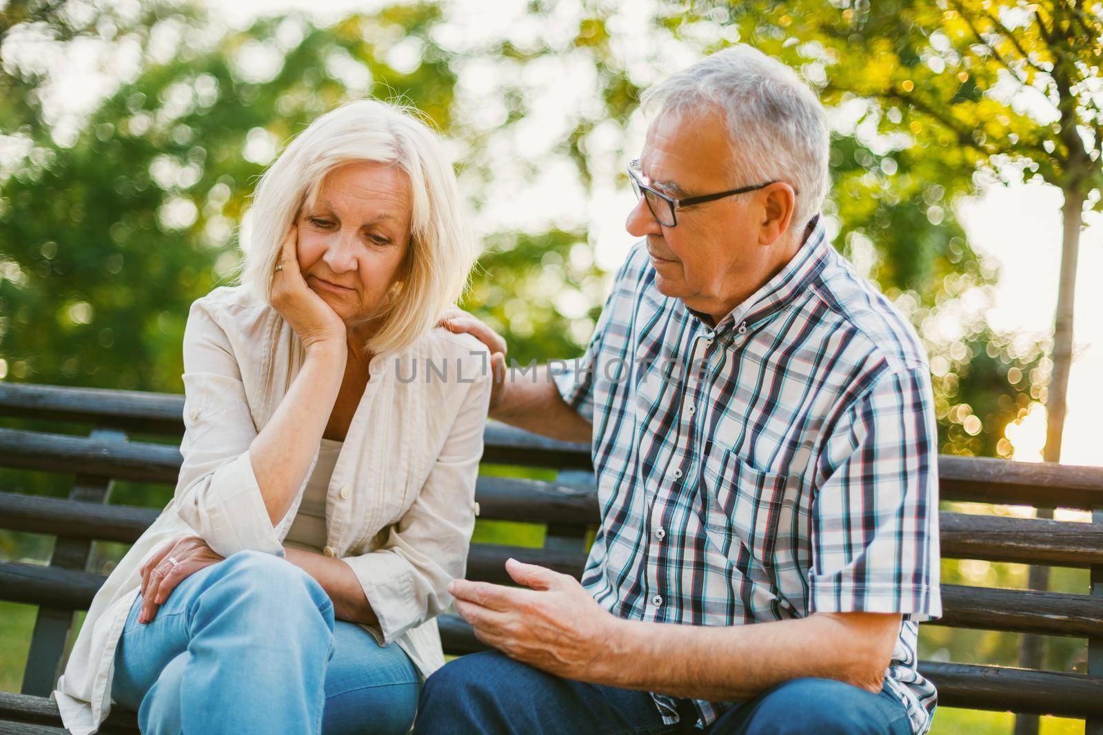 Senior woman is sad and depressed. Friend is consoling her.