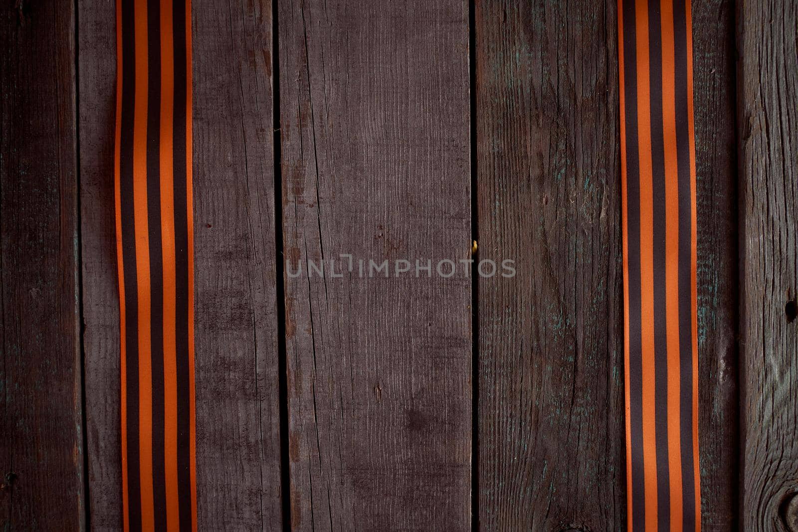 Two St. George ribbons on a wooden table. High quality photo