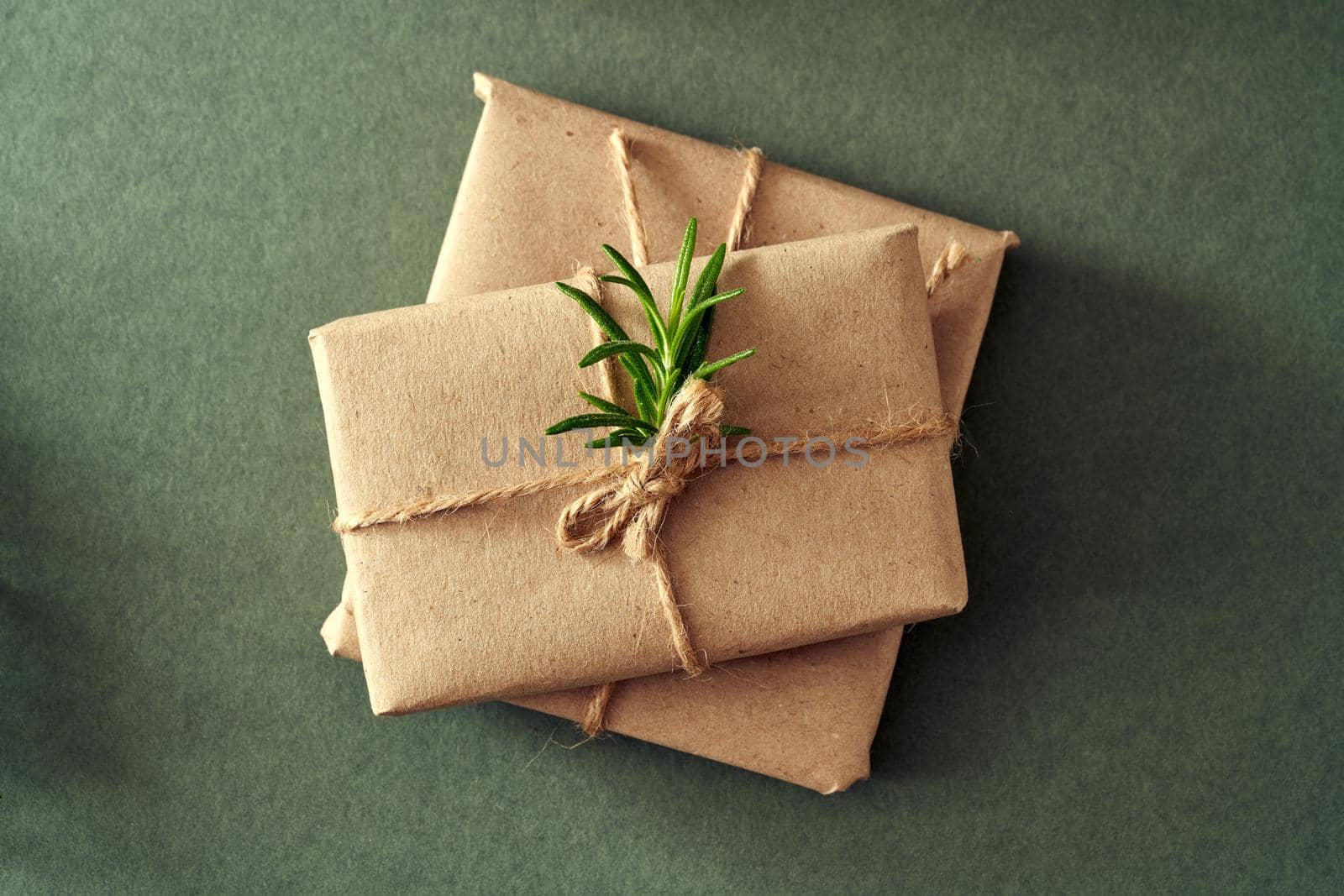 Two Christmas presents wrapped in ecological recycled paper - zero waste concept by madeleine_steinbach