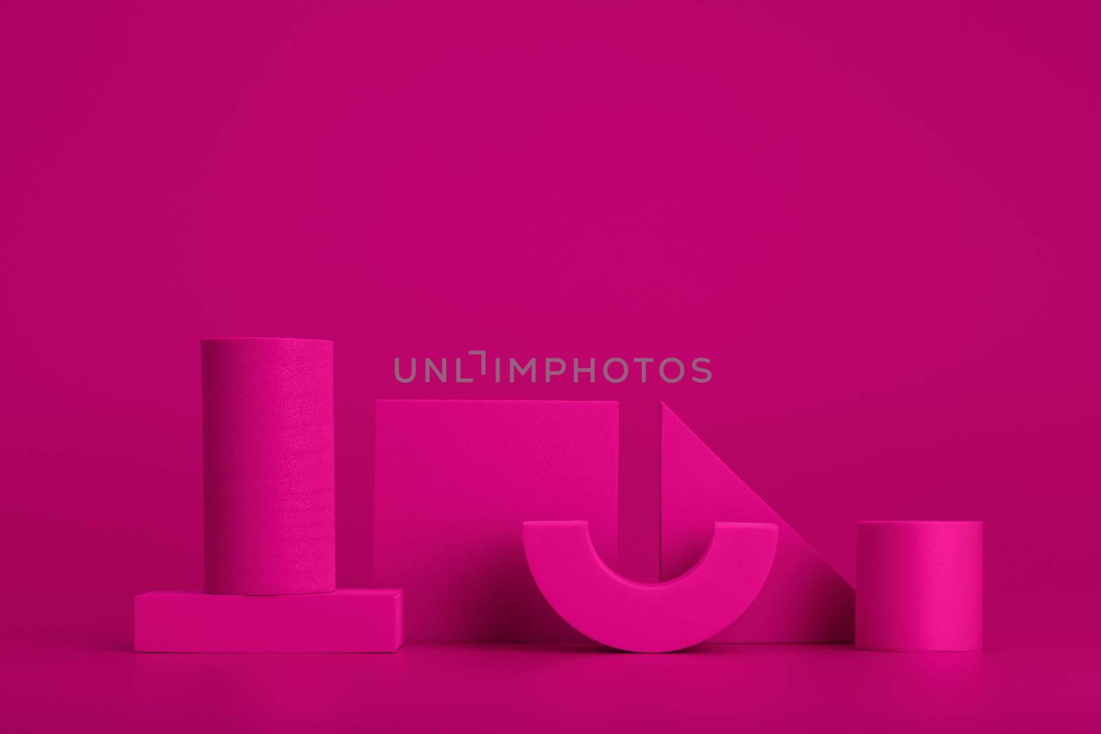 Purple geometric figures against purple background. Concept of geometric minimalistic horizontal still life