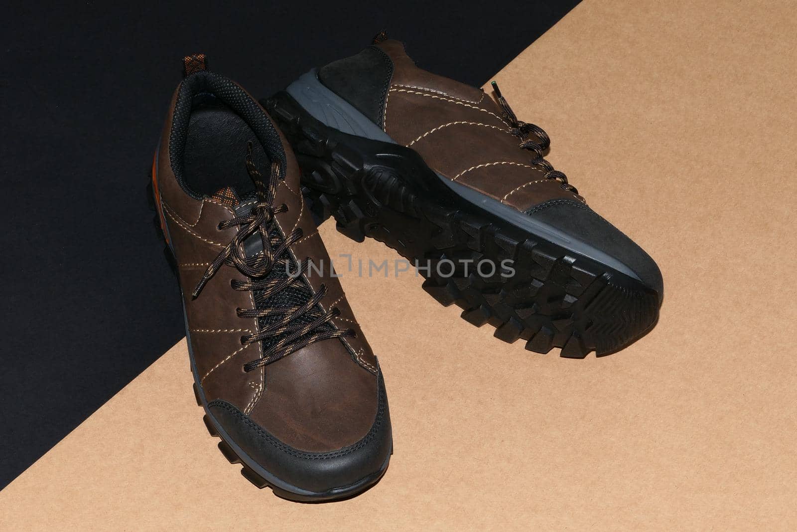 Men's shoes are stylish brown on a black-grey background. by Olga26