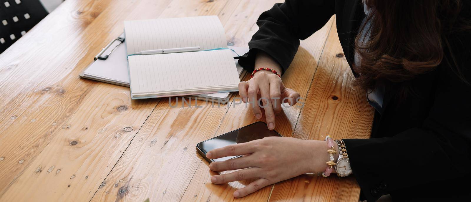 business, technology concept - Portrait of woman hands texting message on smartphone at office. by nateemee