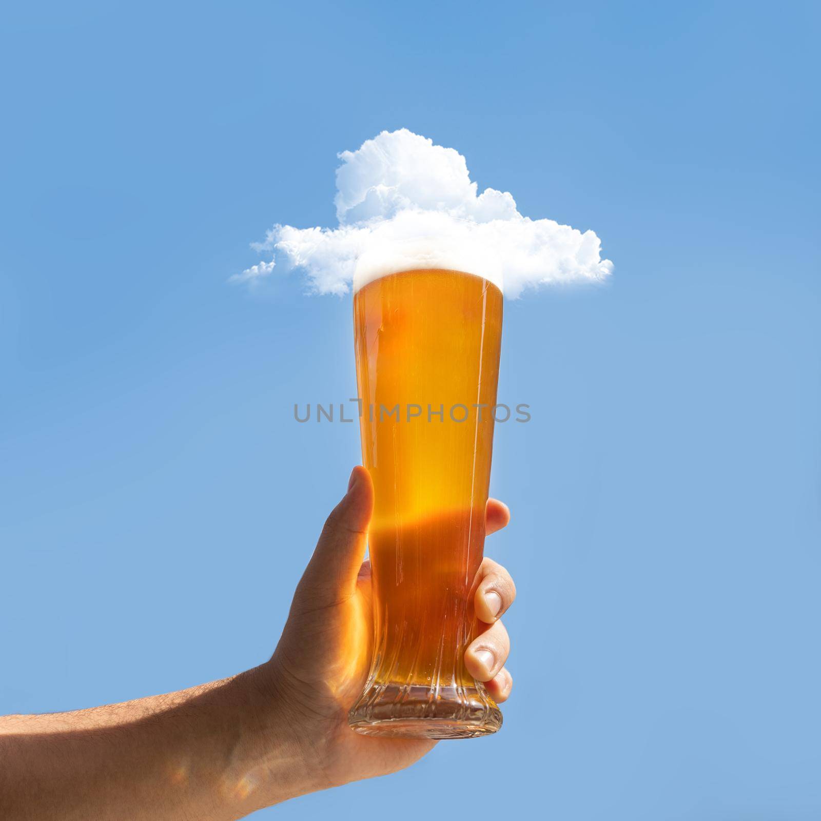 Man holding beer glass with cloud on it by ferhad