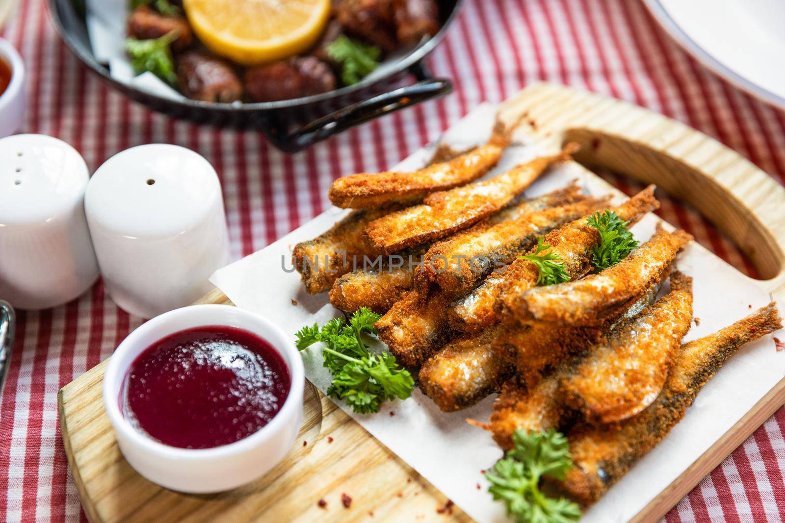Kilka, Sprat fish, ketchup and other snacks close up by ferhad