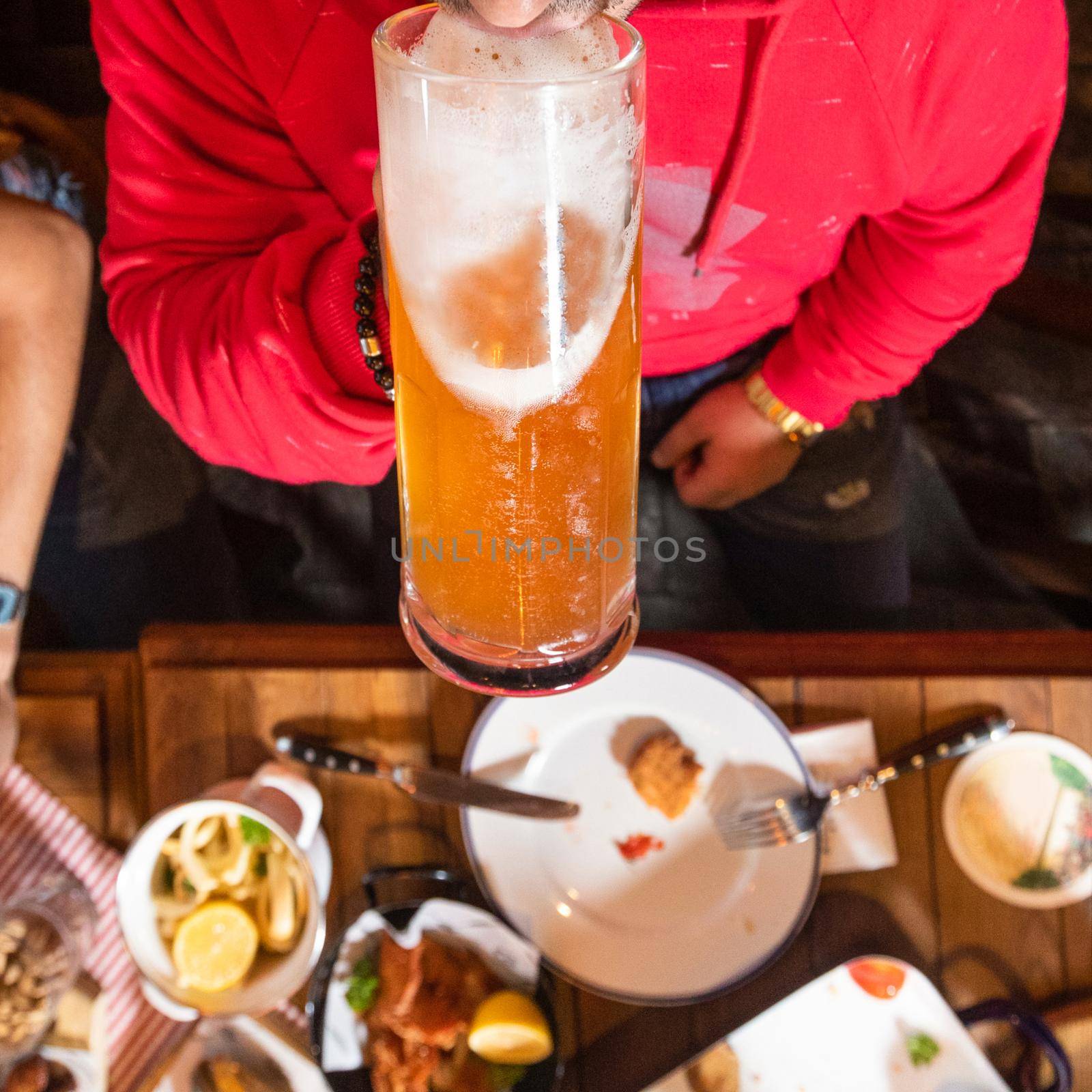 Man drinking beer, view from top