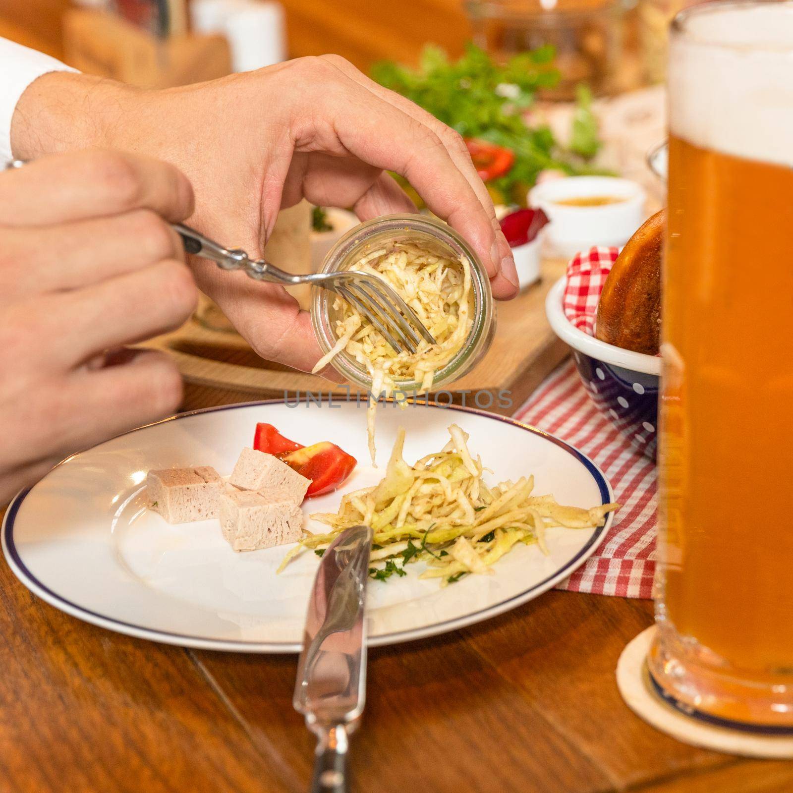 Eating fringed cheese with beer