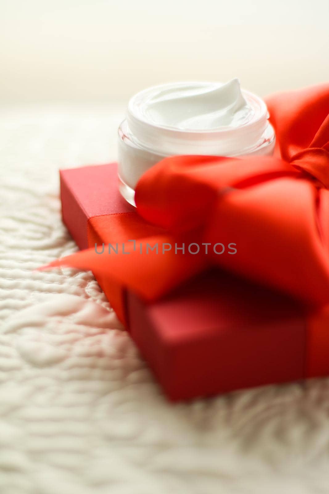 Beauty, cosmetics and skincare styled concept - Luxury face cream jar and red gift box