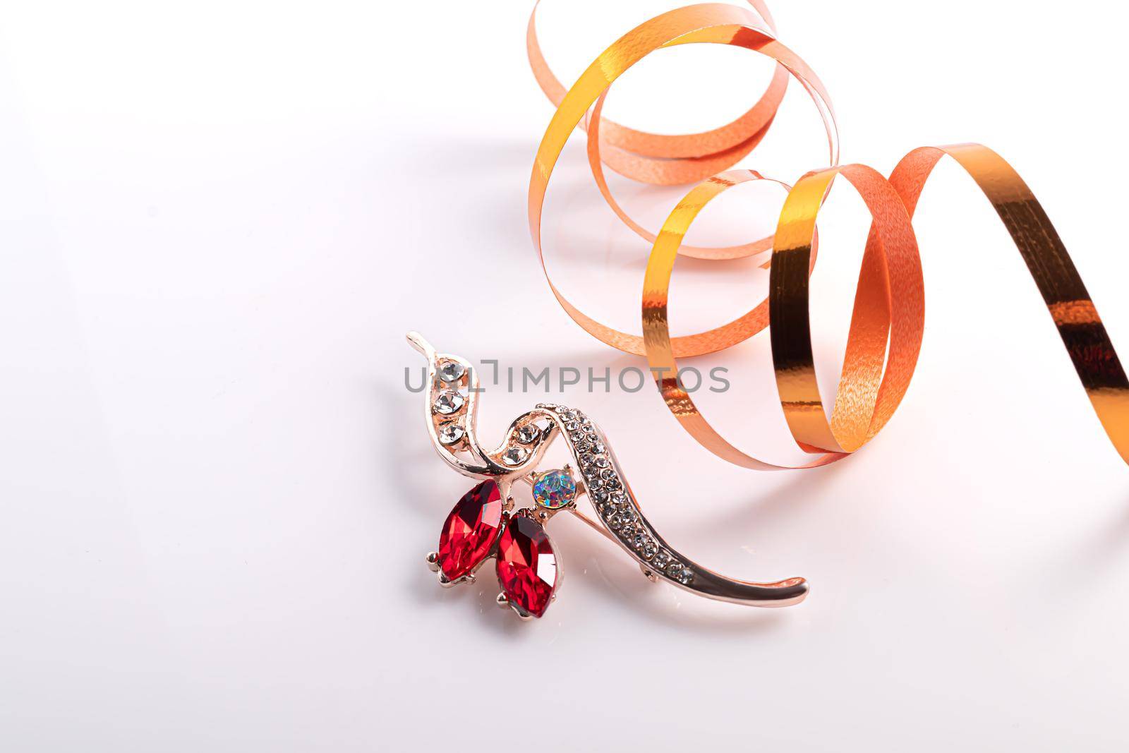 Bijouterie and jewelry on a white background. Brooches and hairpins, earrings and pendants. Isolate. Copy space