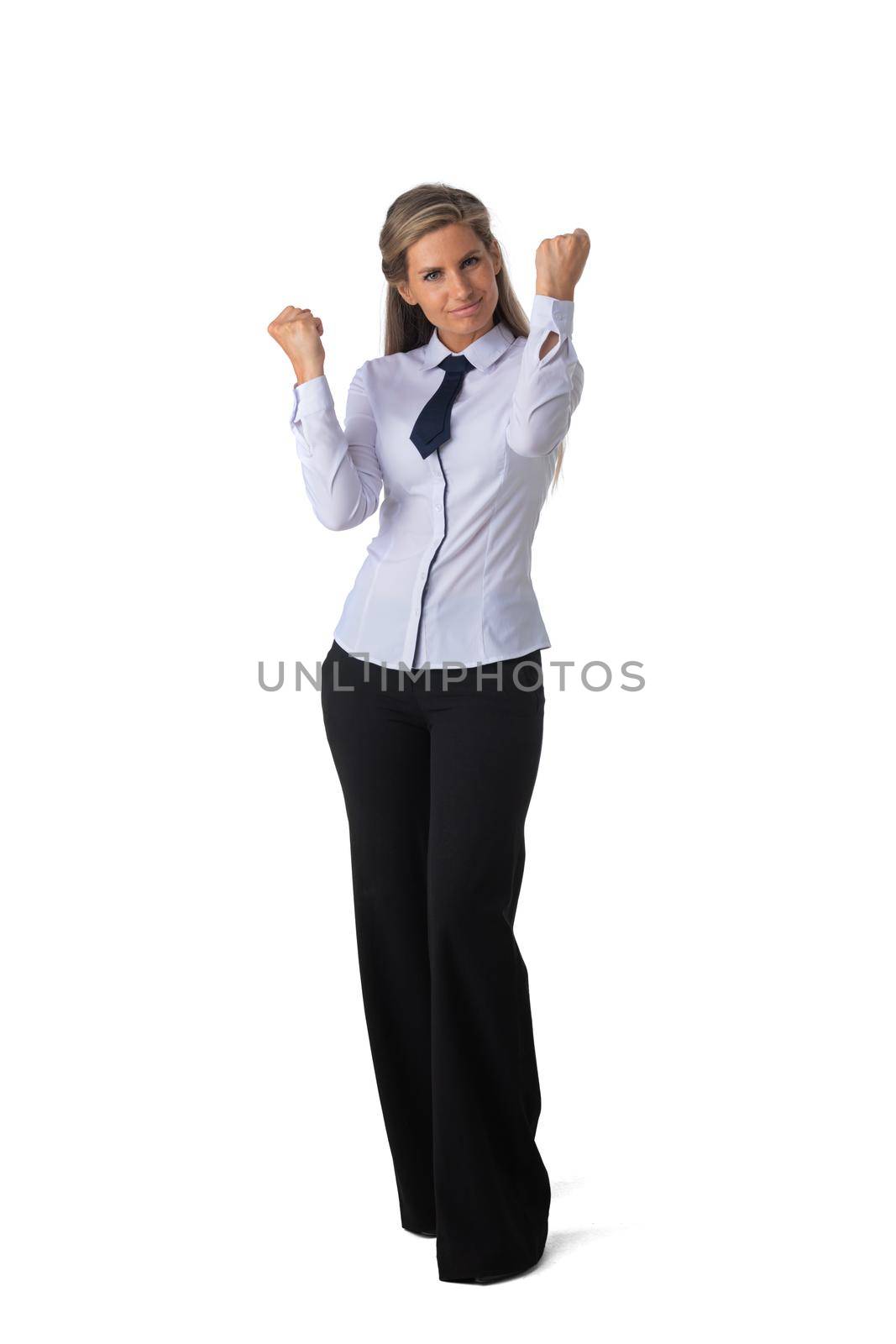 Young business woman winner holding fists isolated on white background full length studio portrait