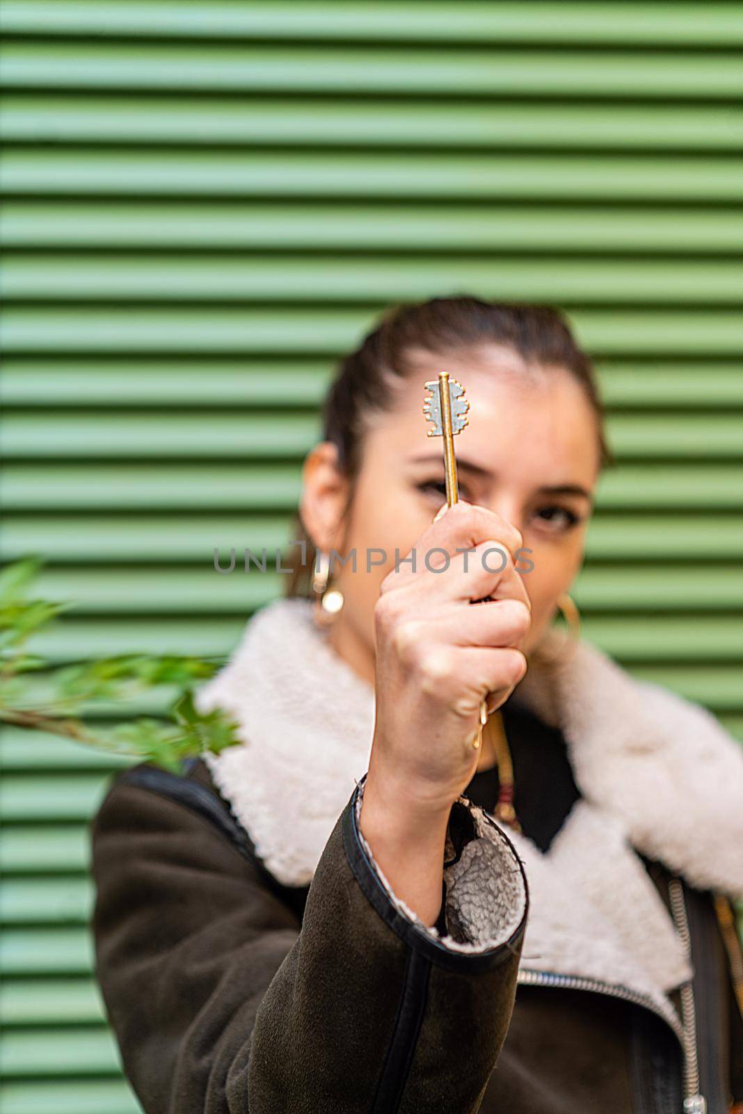 young woman with his new real estate key