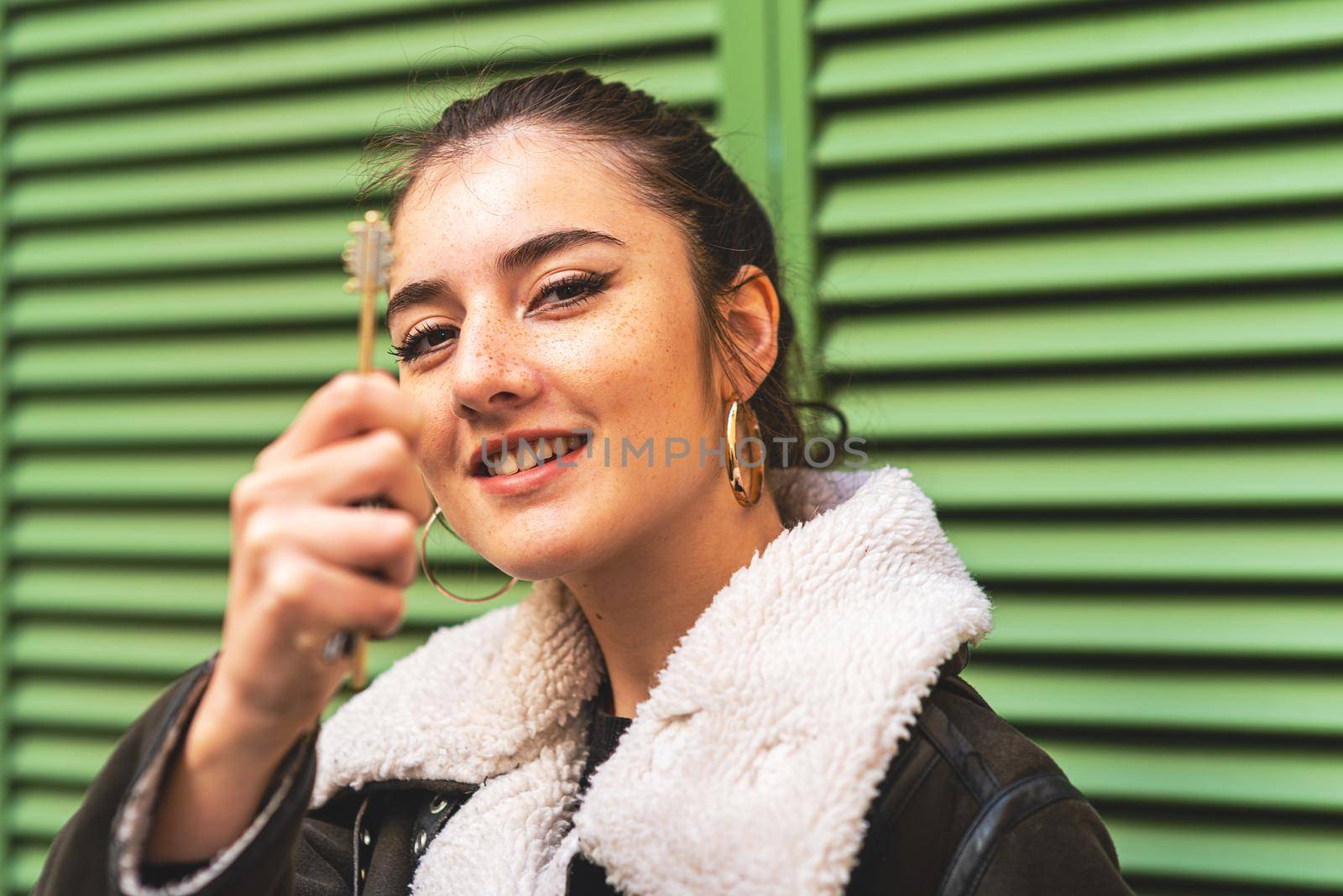 young woman with his new real estate key