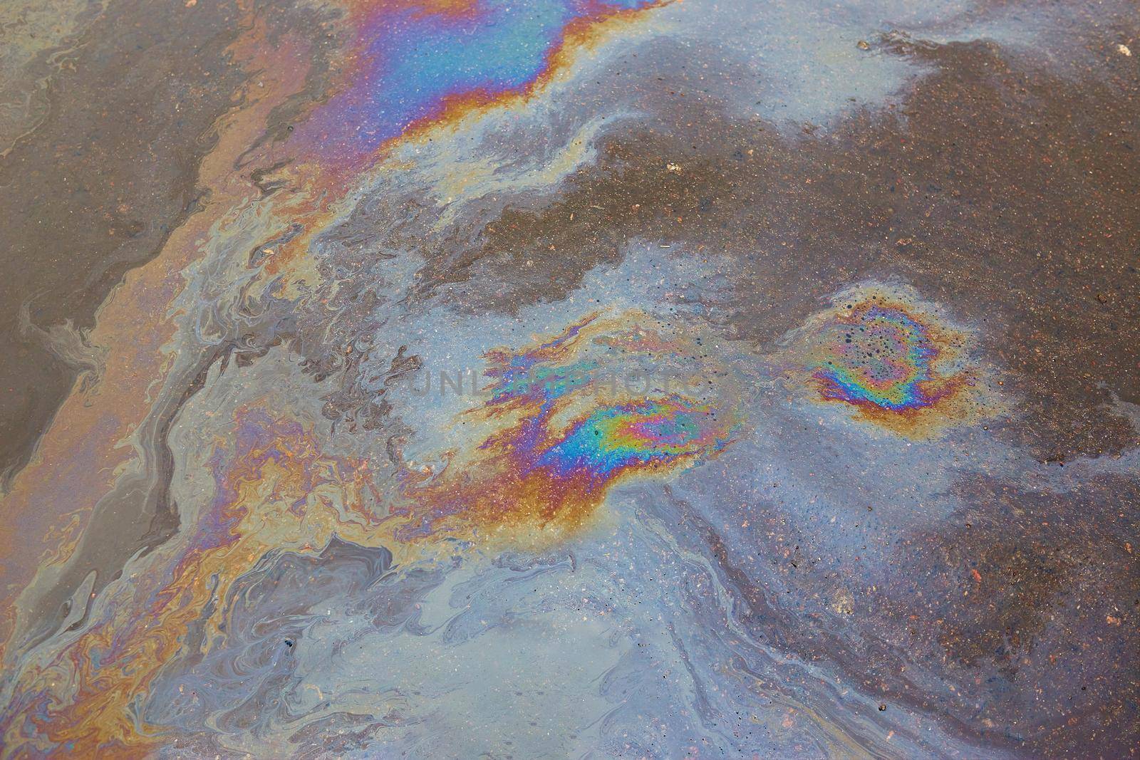 Oil stain on asphalt as texture or background.Environmental pollution concept.