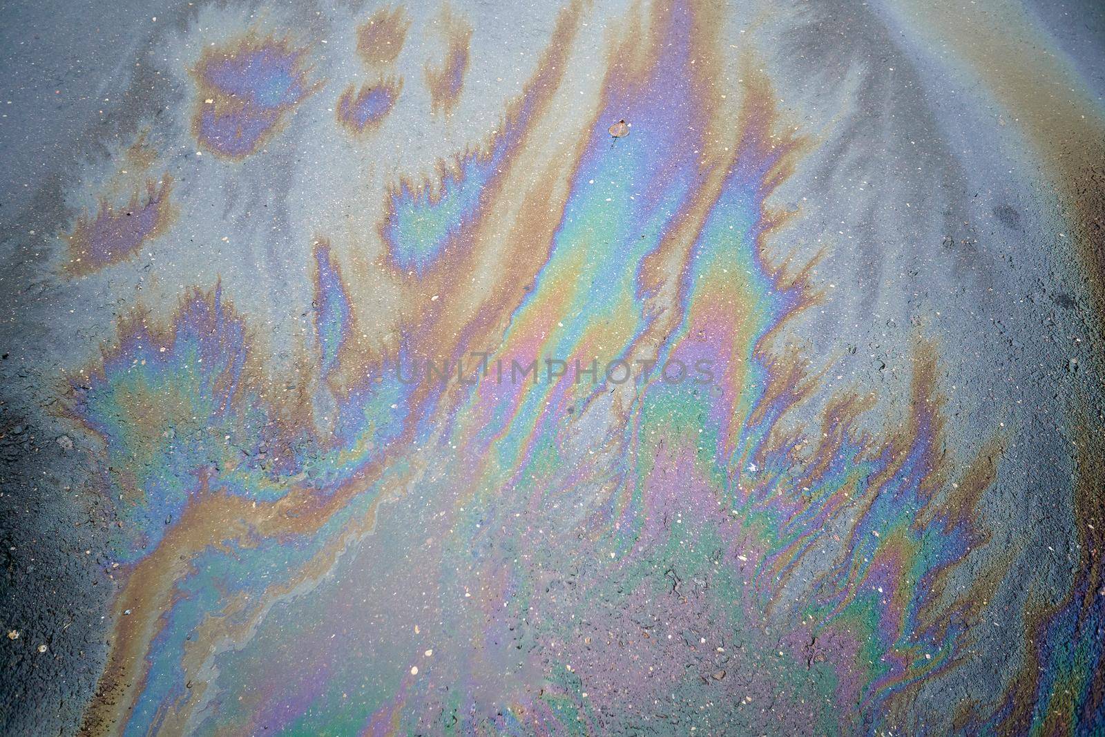 Beautiful abstract colorful background, texture, stains from engine oil on the asphalt.Colorful gas stain on wet asphalt