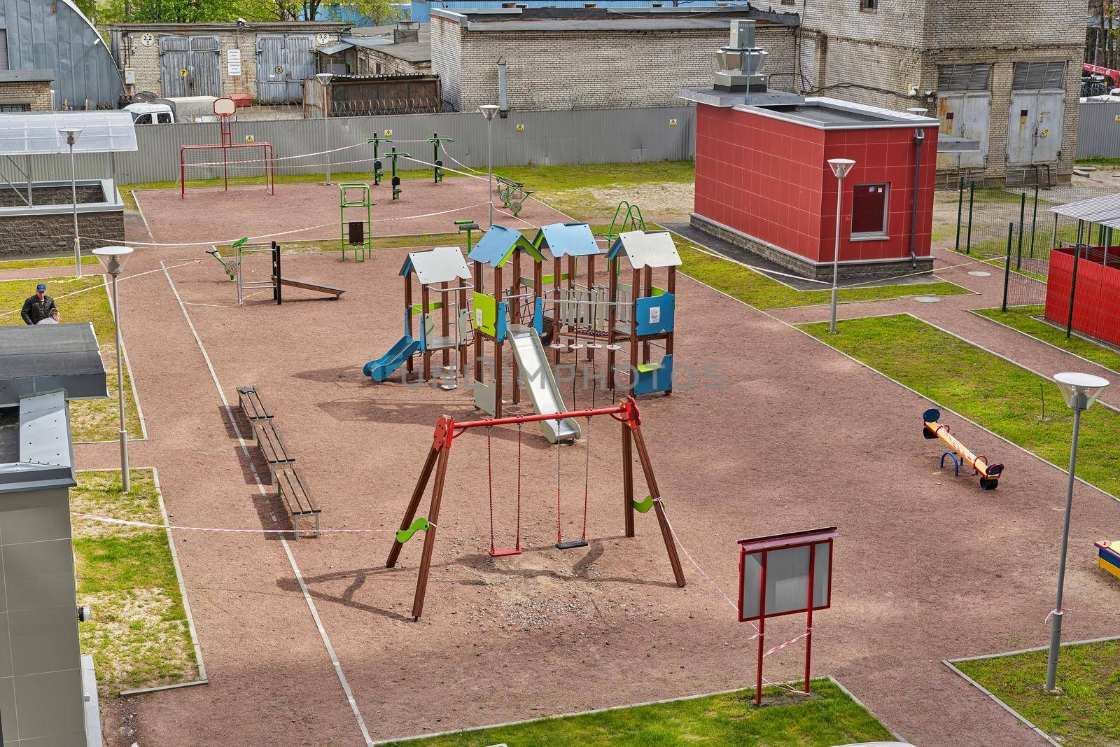 View of the playground in the courtyard of the condominium residential building. Filming from the top floor