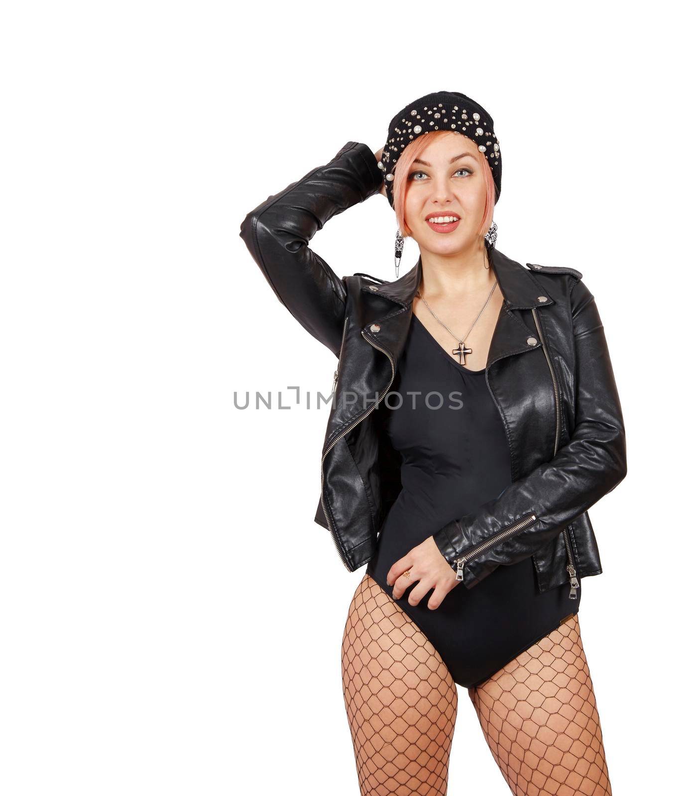 young woman in leather jacket, hat, mesh tights and boots posing standing in studio. closeup on white background