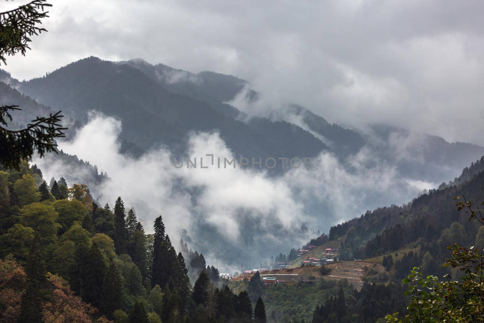 Cloudy Ayder Plateau surrounded by autumn colors near Rize, Turkey.