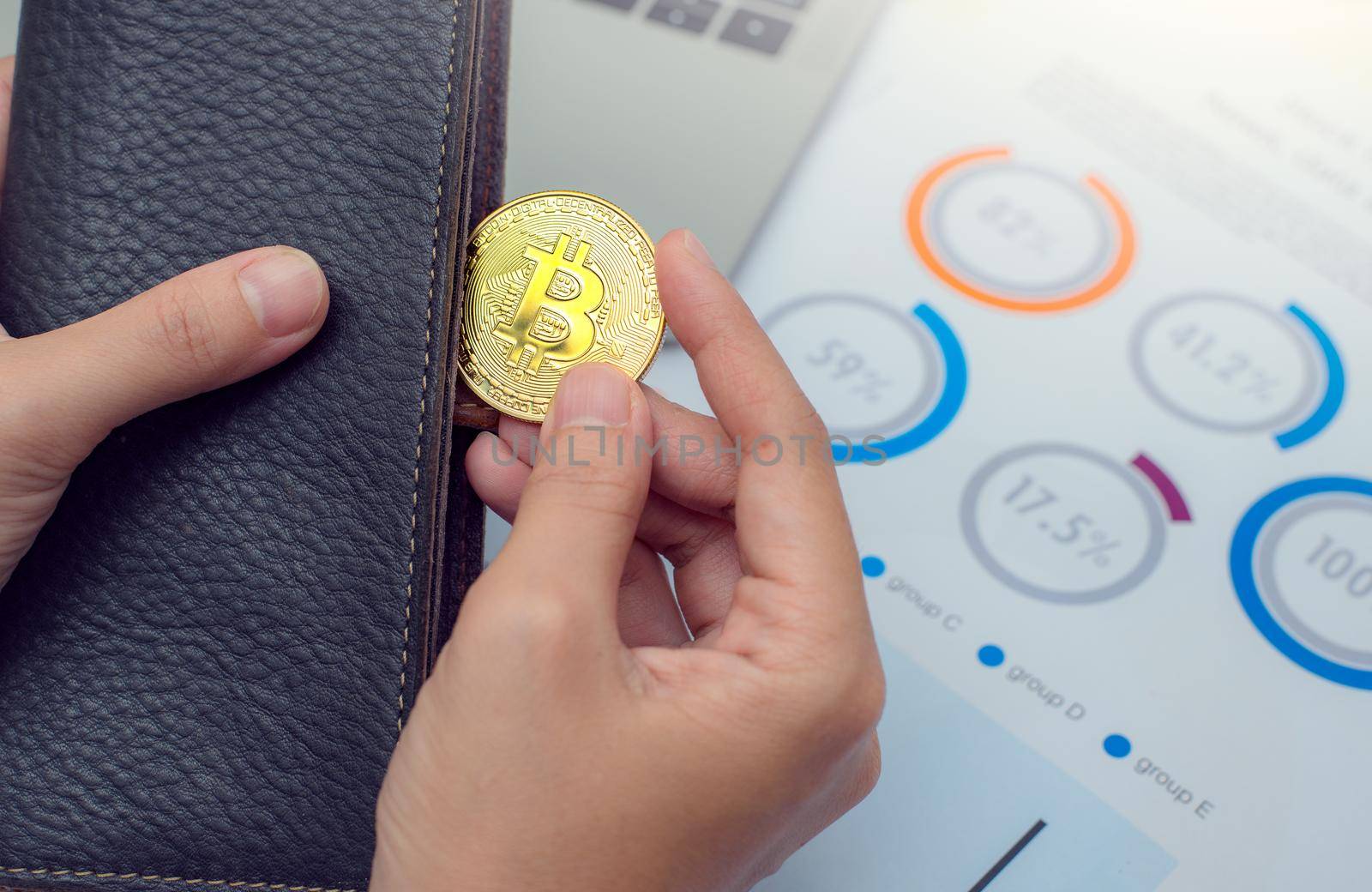 Businessman holding bitcoin coins out of wallet. Virtual currency. Crypto currency. New virtual money.