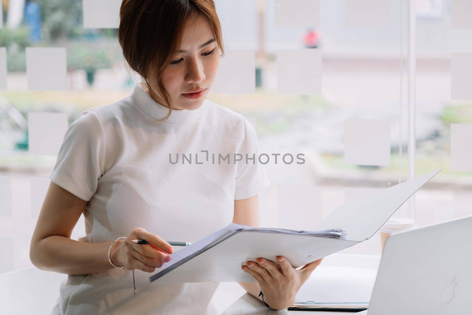 Audit working, Businessman work with paper document on clipping board in office by nateemee