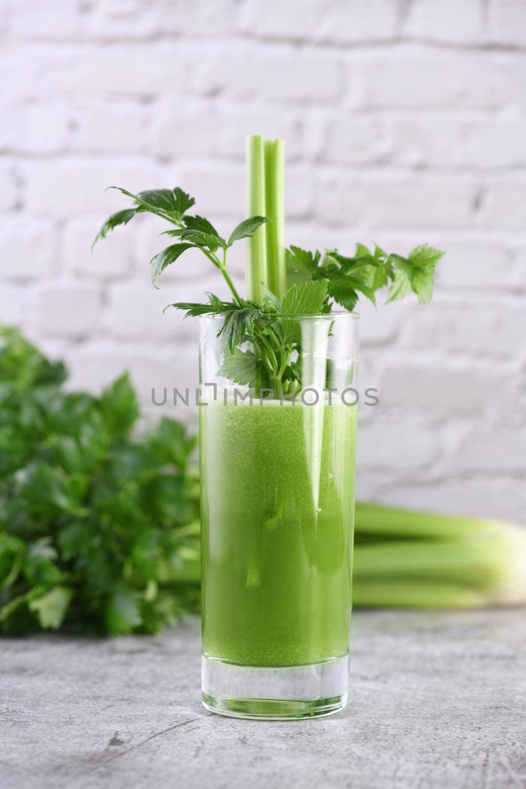  Glass of freshly made celery smoothie.   by Apolonia
