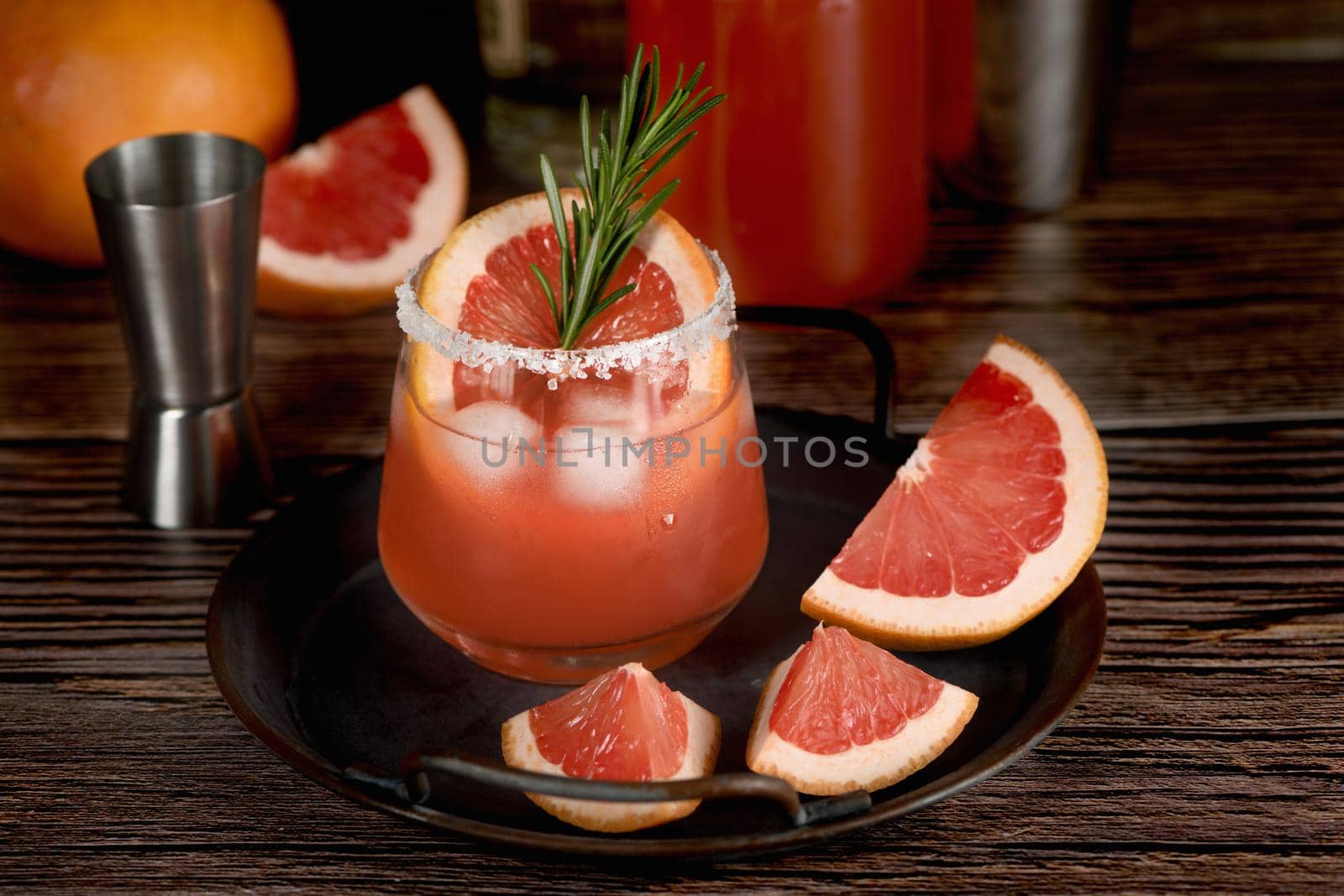 Cocktail tequila fresh grapefruit juice combined and rosemary. A festive drink is ideal for brunch, parties and holidays.